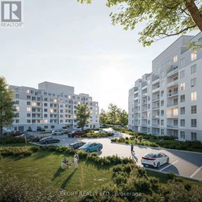 Belleville (Thurlow Ward) house for rent - A modern apartment complex with cars parked in the driveway and people walking around.