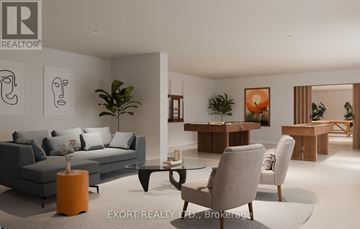 Belleville (Thurlow Ward) house for rent - A modern living room with a grey sofa, a coffee table, and a dining table with chairs.