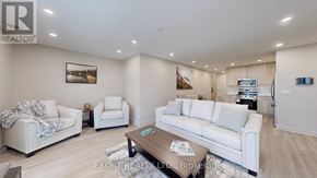 Belleville (Thurlow Ward) house for rent - A living room with white furniture and a painting on the wall.