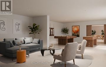 Belleville (Thurlow Ward) house for rent - A modern living room with a grey sofa, a coffee table, and a dining table with chairs.