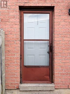Oshawa (Lakeview) house for rent - A red door with a glass window and a handle.
