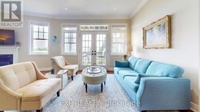 Collingwood townhouse for rent - A living room with a blue couch and a coffee table.