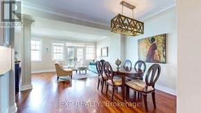 Collingwood townhouse for rent - A dining room with a wooden table and chairs.