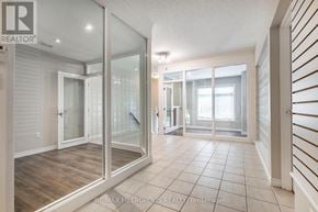 Waterloo townhouse for rent - A spacious room with a glass door leading to a balcony.