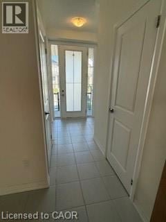 Hamilton townhouse for rent - A hallway with a door at the end.