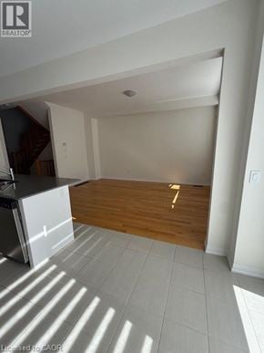 Hamilton townhouse for rent - A room with a wooden floor and white walls.