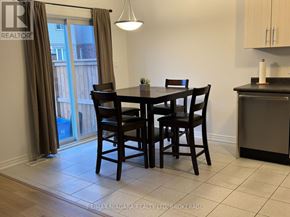 Welland (Coyle Creek) townhouse for rent - A dining room with a table set for four.