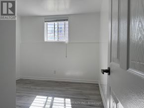 St. Catharines (E. Chester) house for rent - A room with a window and a door.