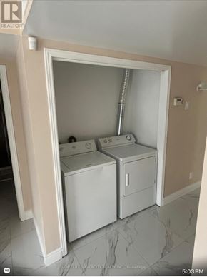 St. Catharines (E. Chester) house for rent - A small laundry room with a washer and dryer.