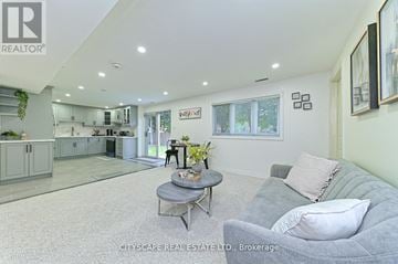 Burlington (Bayview) house for rent - A living room with a grey couch and a coffee table.