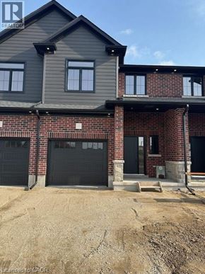 Ingersoll townhouse for rent - A house under construction with a grey roof and a brick facade.