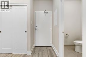 Binbrook apartment for rent - A white door in a room with a toilet in the background.