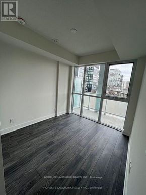 Toronto (Don Valley Village) condo for rent - A room with a view of a cityscape through large windows.