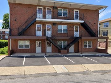 Lodi apartment for rent - A red brick building with a black metal staircase.