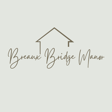 Breaux Bridge apartment for rent - A logo with a house and the words "Breaux Bridge Manor" written underneath it.