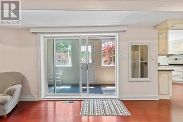 Toronto (Bridle Path-Sunnybrook-York Mills) house for rent - A living room with a couch and a sliding glass door.