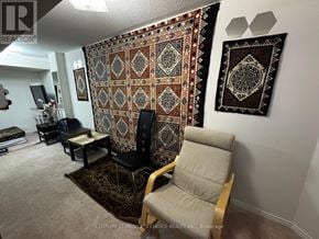 Mississauga (Meadowvale Village) townhouse for rent - A living room with a large tapestry hanging on the wall.