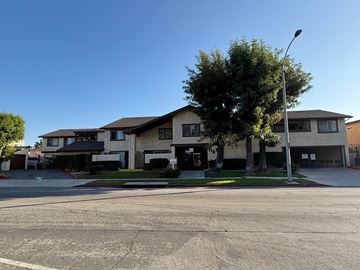 Anaheim apartment for rent - A residential area with houses and a tree.