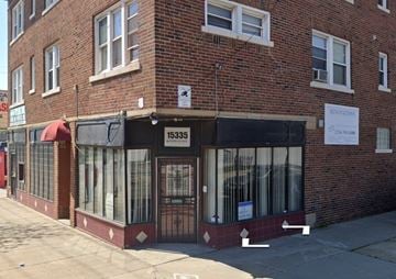 Cleveland apartment for rent - A brick building with a black awning and a sign that reads 15335 KENNEDY ST.