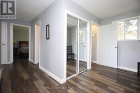 Kawartha Lakes (Bexley) house for rent - A room with a wooden floor and white walls.
