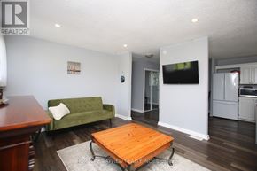 Kawartha Lakes (Bexley) house for rent - A living room with a green couch and a wooden coffee table.