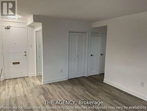 Toronto (Westminster-Branson) house for rent - A white door with a brass handle is in a room with white walls and wood flooring.