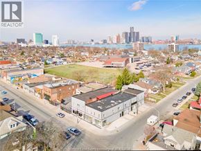 Windsor apartment for rent - A bird's eye view of a city street with buildings and cars.