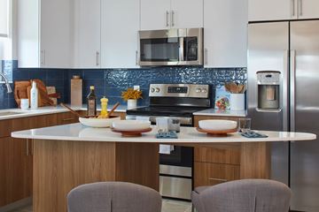 Ft Lauderdale apartment for rent - A modern kitchen with a white countertop and stainless steel appliances.
