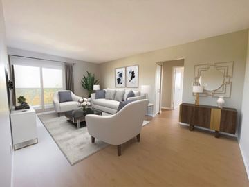 Windsor apartment for rent - A living room with a white sofa and a glass table.