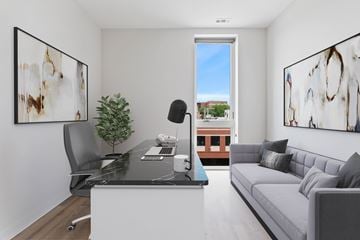 Chicago apartment for rent - A modern living room with a black and white abstract painting on the wall.