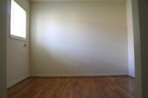 Newport News apartment for rent - an empty room with a wooden floor and a window