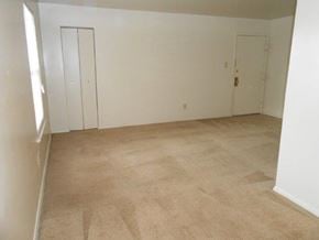 Newport News apartment for rent - an empty room with a carpeted floor and white walls