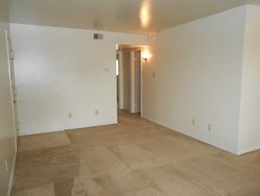 Newport News apartment for rent - an empty living room with white walls and tile floor