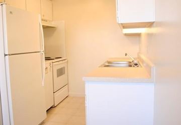 Newport News apartment for rent - a kitchen with a sink and a refrigerator