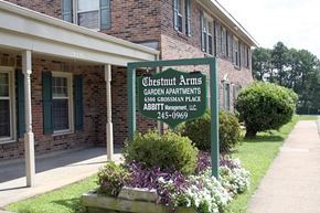 Newport News apartment for rent - a green sign in front of a building
