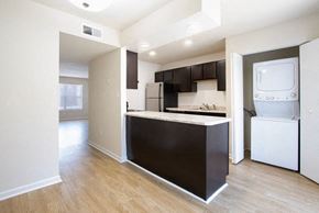 Newport News townhouse for rent - A kitchen with a black counter top and white appliances.