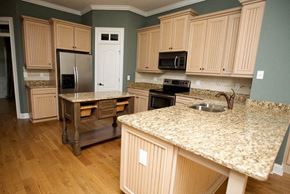 Kennesaw apartment for rent - a kitchen with wooden cabinets and granite counter tops