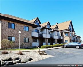 Madison apartment for rent - an apartment building with a car parked in a parking lot