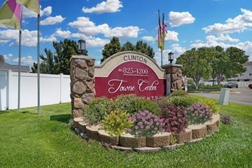 Clinton apartment for rent - Clinton Tournee Centre sign with flowers in front.