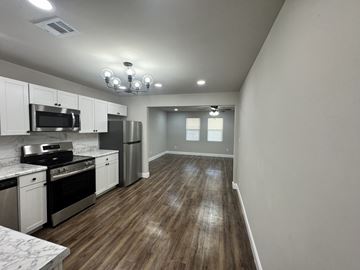 Warner Robins apartment for rent - A kitchen with white cabinets and stainless steel appliances.