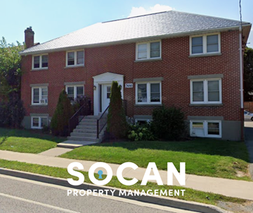 Oshawa apartment for rent - A red brick house with the words "SOCAN PROPERTY MANAGEMENT" superimposed on the image.