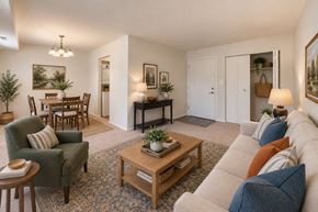 Parkville townhouse for rent - A living room with a sofa, armchair, and coffee table.