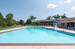 Parkville townhouse for rent - Large swimming pool with lounge chairs surrounding it