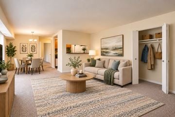 Fort Washington apartment for rent - A living room with a couch, coffee table, and a painting on the wall.