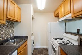 Fort Washington apartment for rent - a kitchen with a stove refrigerator and sink