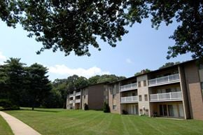 Laurel apartment for rent - Apartment building with a green lawn in front.