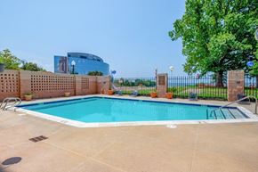 Newport News apartment for rent - a swimming pool with a fence around it