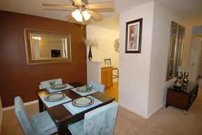 Parkville apartment for rent - A brown dining room with a table set for four.