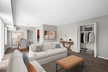 Laurel apartment for rent - a living room and dining room with a couch and a table