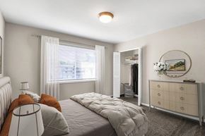 Laurel apartment for rent - a bedroom with a bed and a dresser